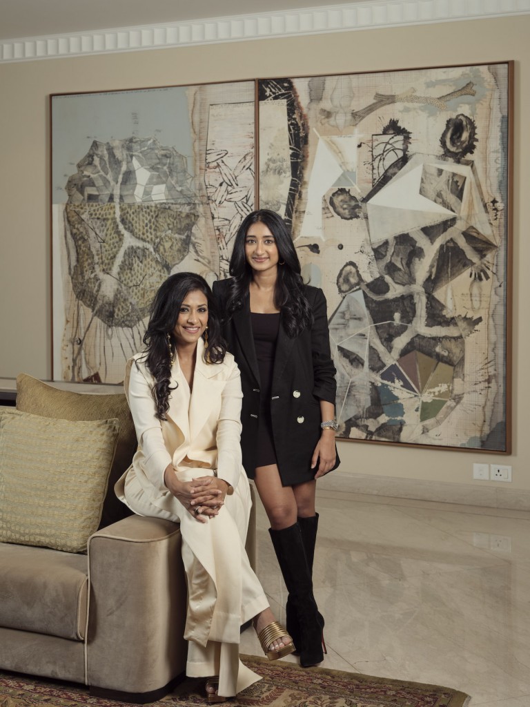 Aparajita Jain and her daughter Devashi Jain, with a Jitish Kallat work in the background. Courtesy of Aparajita Jain and Devashi Jain. 