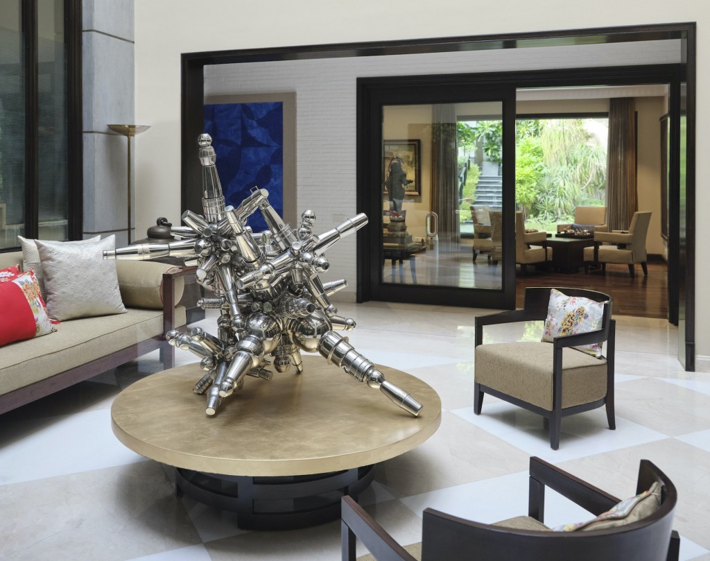 A sculpture by Subodh Gupta on the coffee table, and a painting on the left by Kamrooz Aram. Courtesy of Aparajita Jain